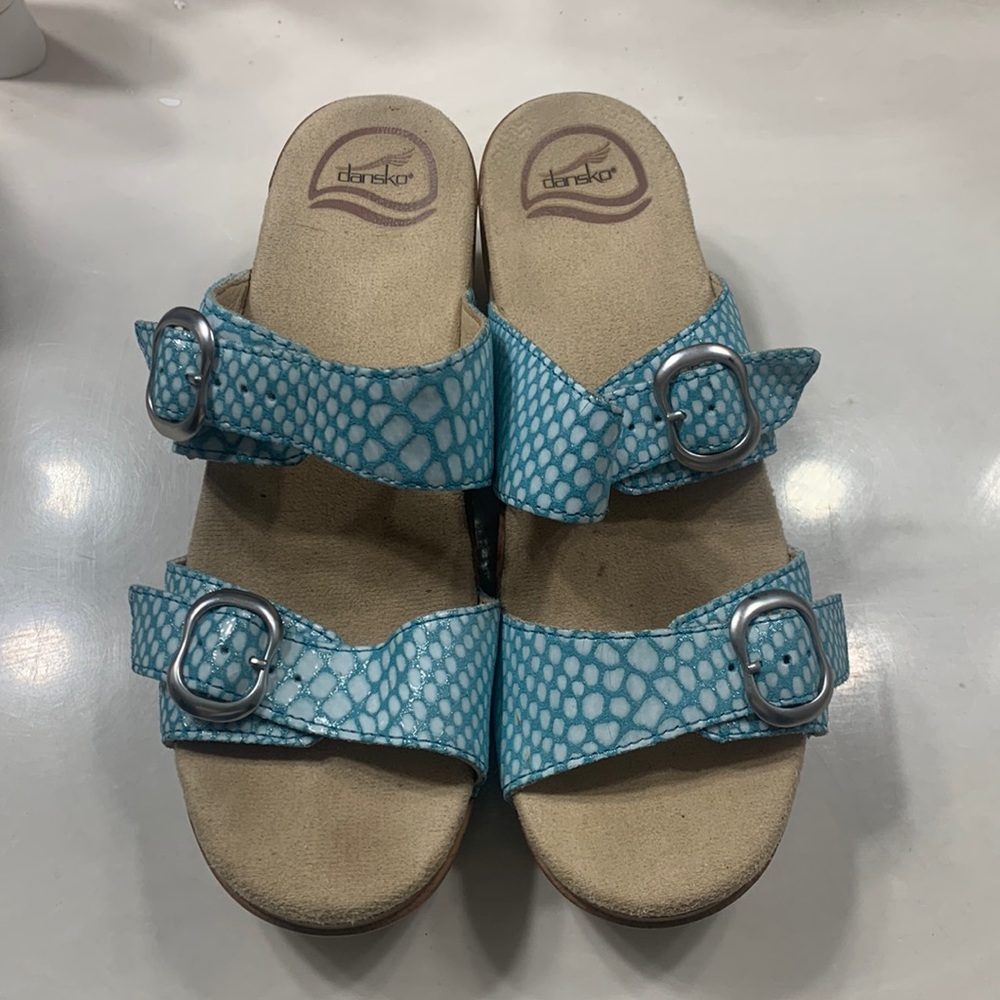 Dansko sandals with a heel size 7 inside says size 38